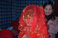 GUIZHOU PROVINCE, CHINA Ã¢â¬â CIRCA DECEMBER 2017: A bride covered with red wedding veil.